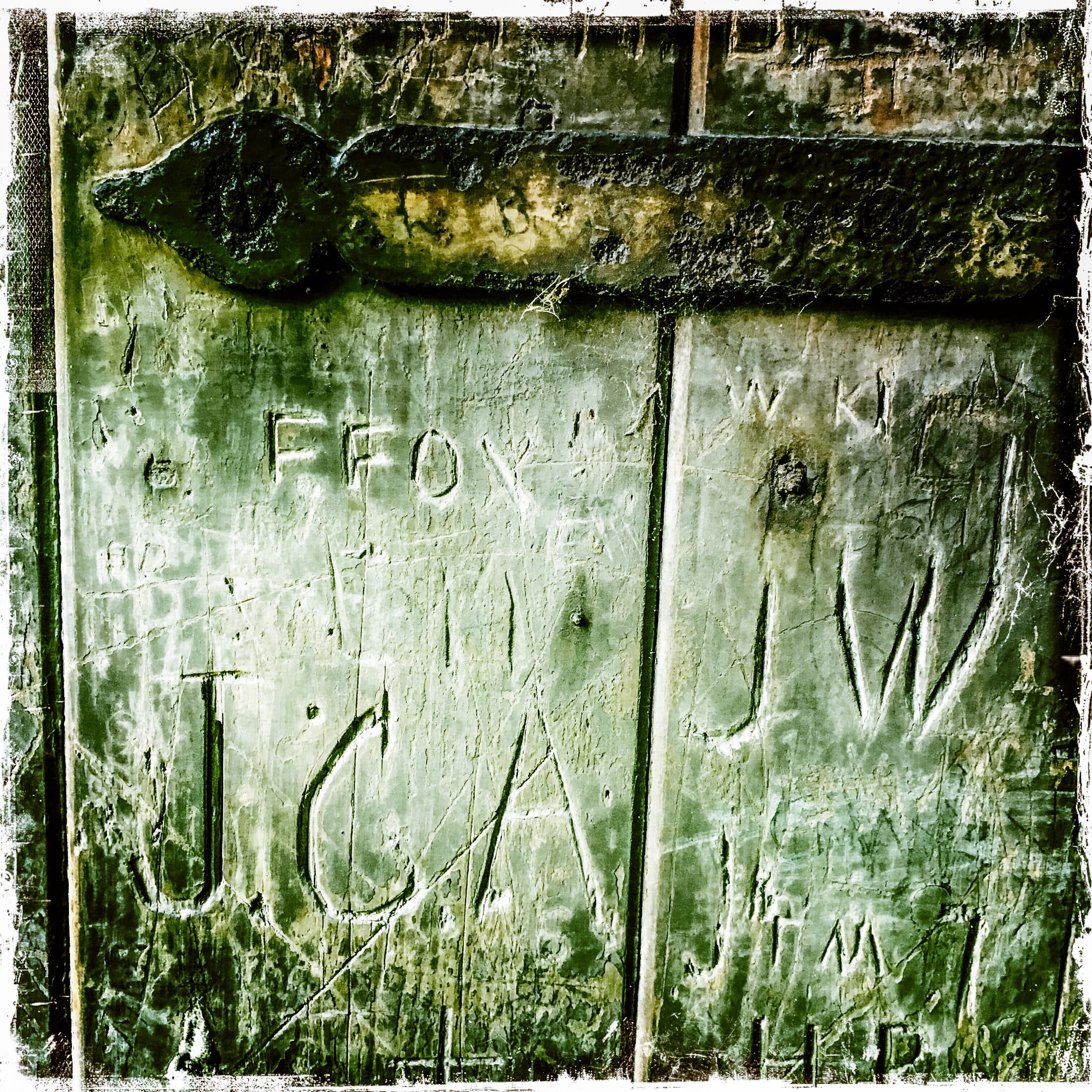 Carved initials, weathered wood, iPhone